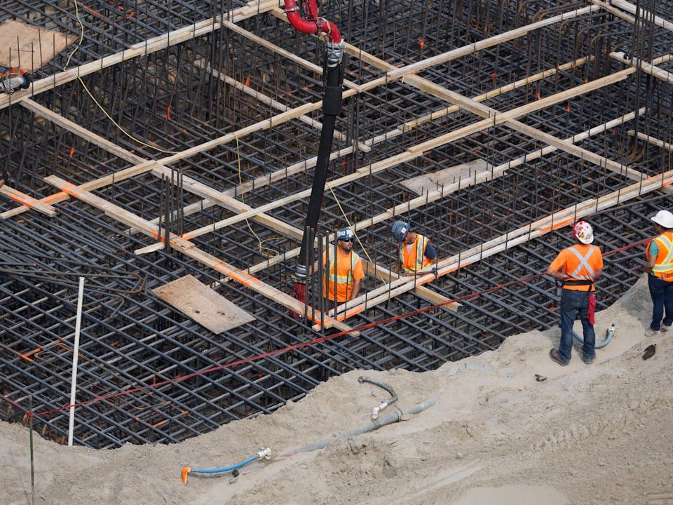 Construction crew tracking hours on a job site