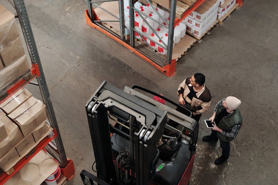 Warehouse team tracking time during logistics work