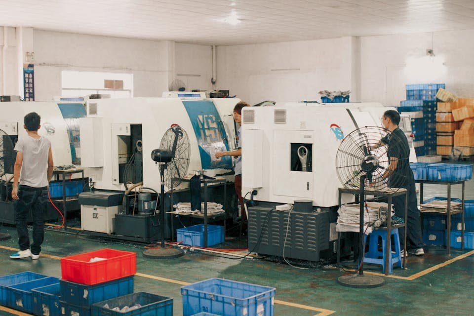 Manufacturing team tracking time across shift work