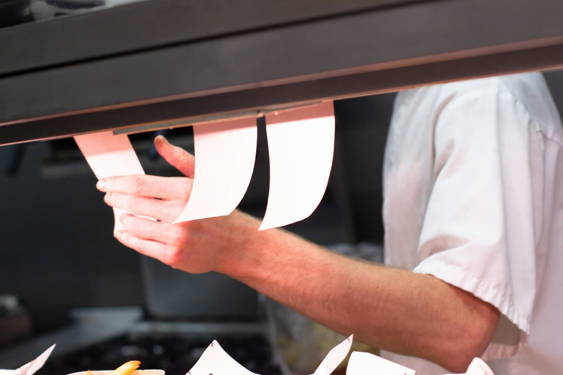 Restaurant staff using time tracking during a busy service